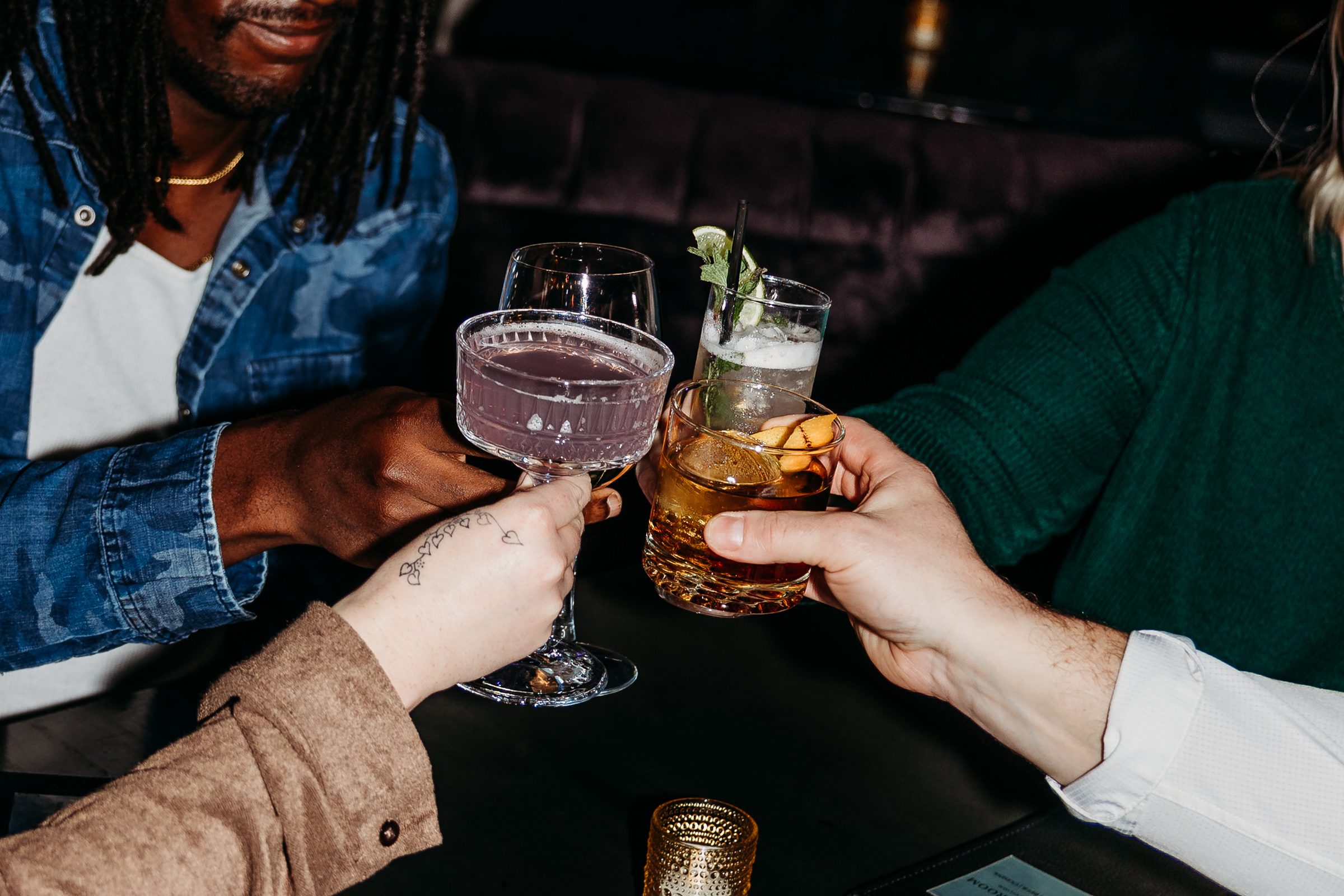 Friends toasting with cocktails