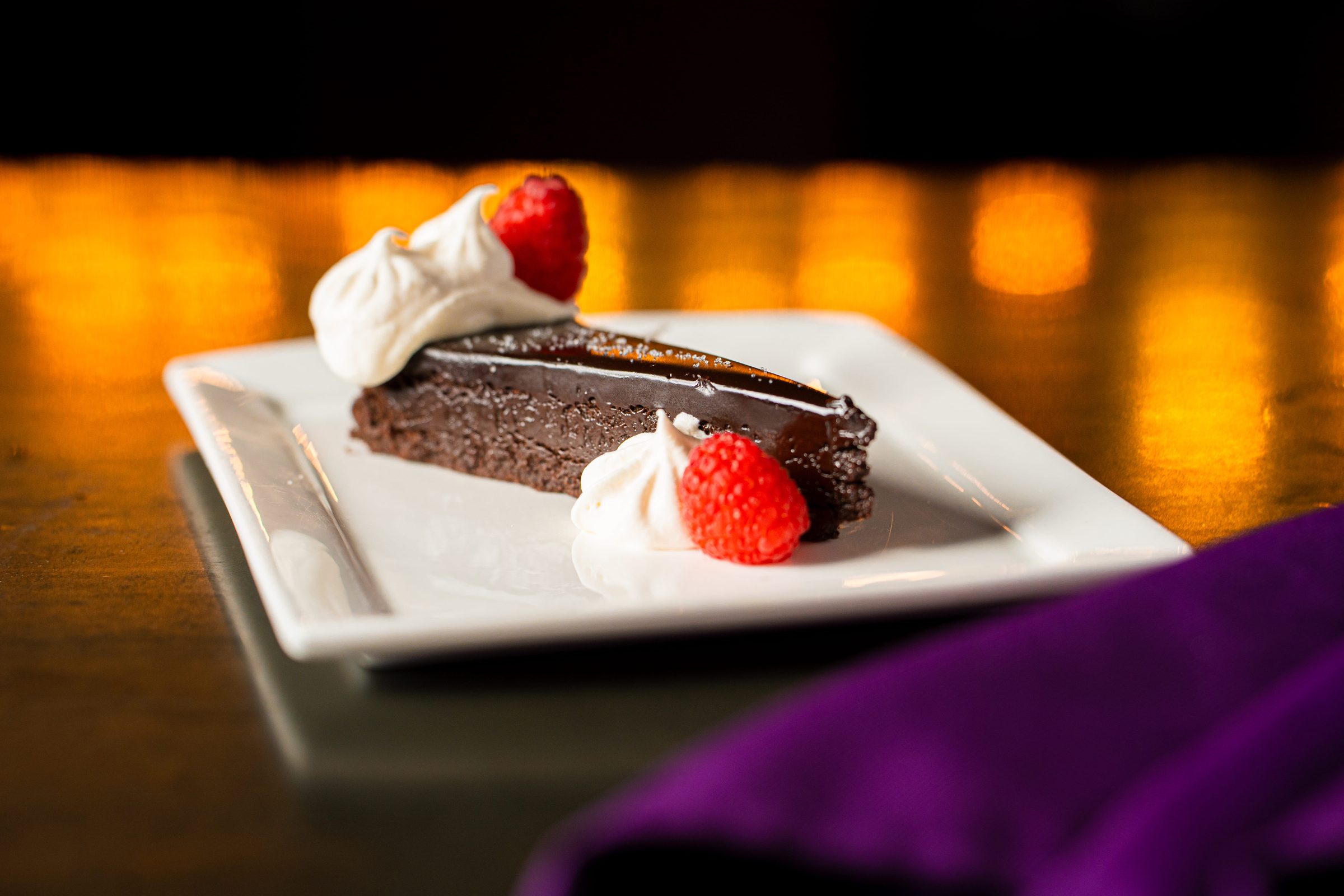 Chocolate cake with whipped cream and strawberry
